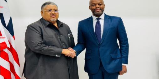 Minister of Commerce and Industry, Hon. Amin Modad (L) with AfCFTA Secretary General, H. E. Wamkele Mene