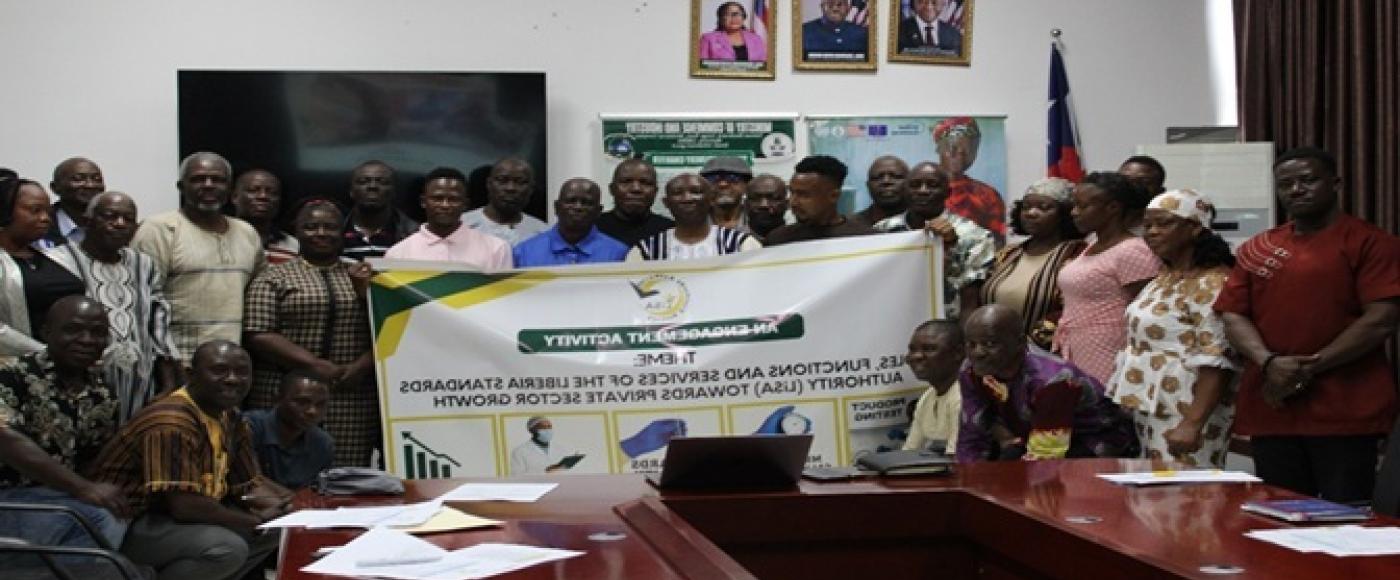Participants pose for press